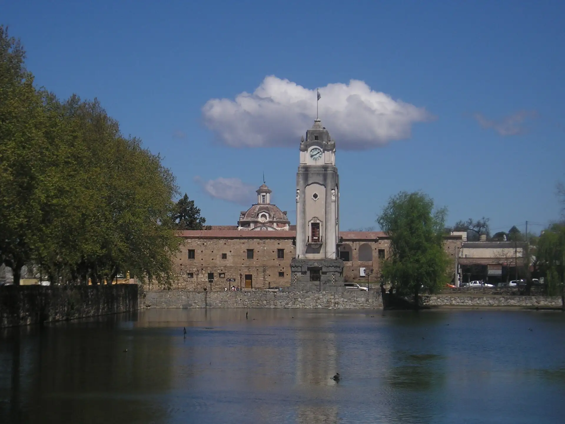 Clock tower and Jesuit residence across Tajamar in Alta Gracia
