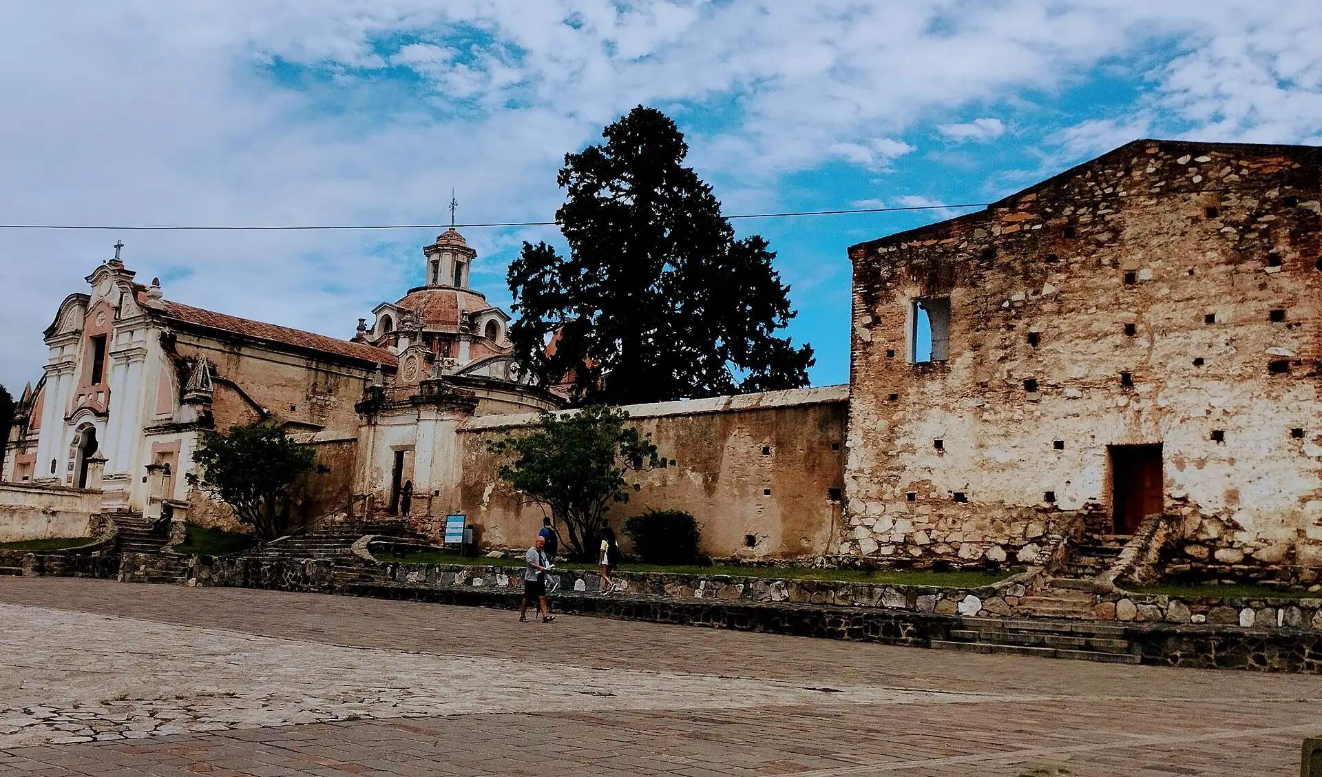 Jesuit historic buildings beside a paved square in Alta Gracia