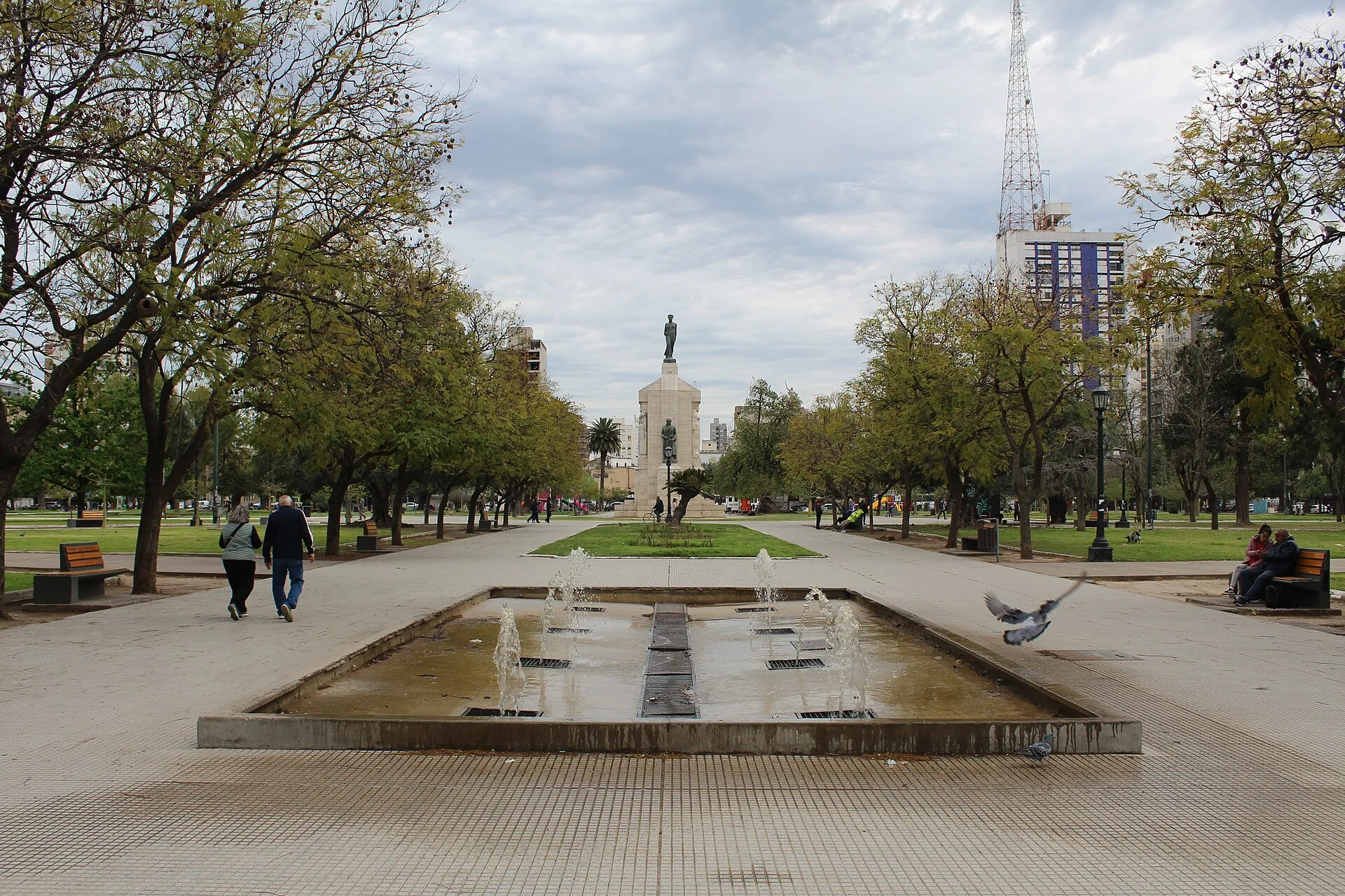 Fountain, trees and central buildings around Plaza Rivadavia