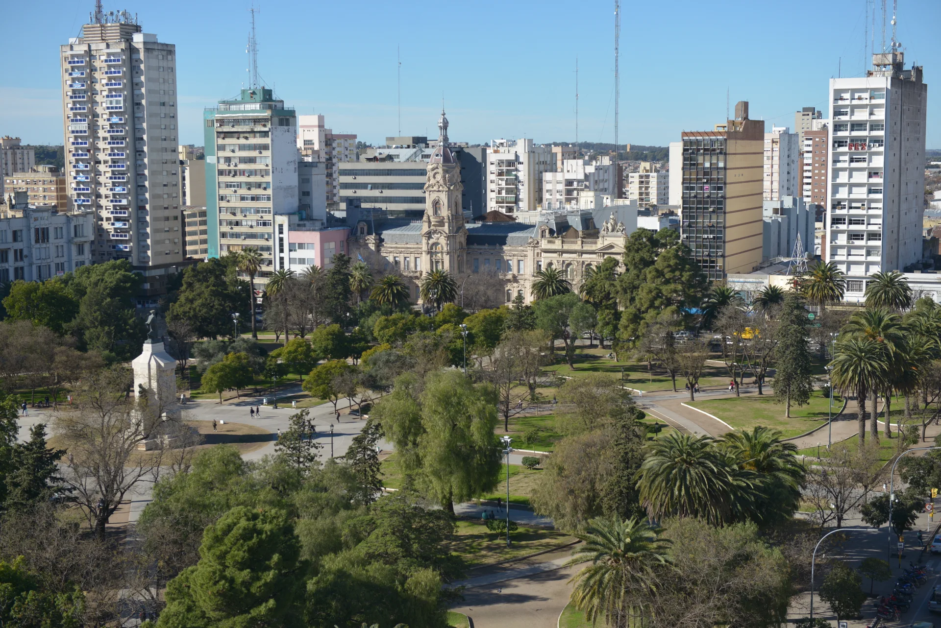 Plaza Rivadavia gardens with apartment buildings beyond