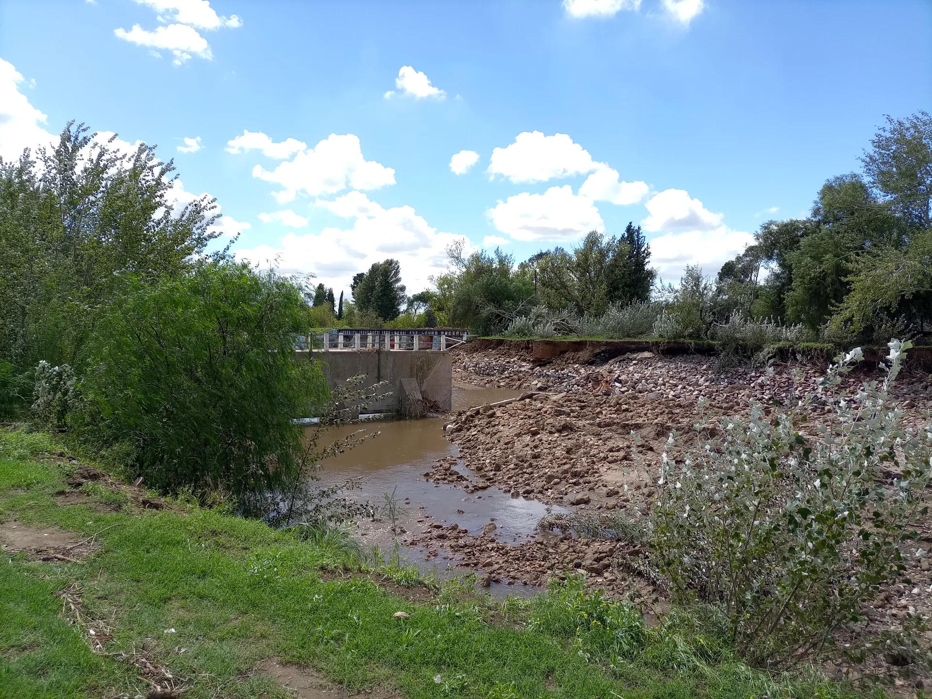 Damaged waterway banks after the March 2025 Bahía Blanca flood