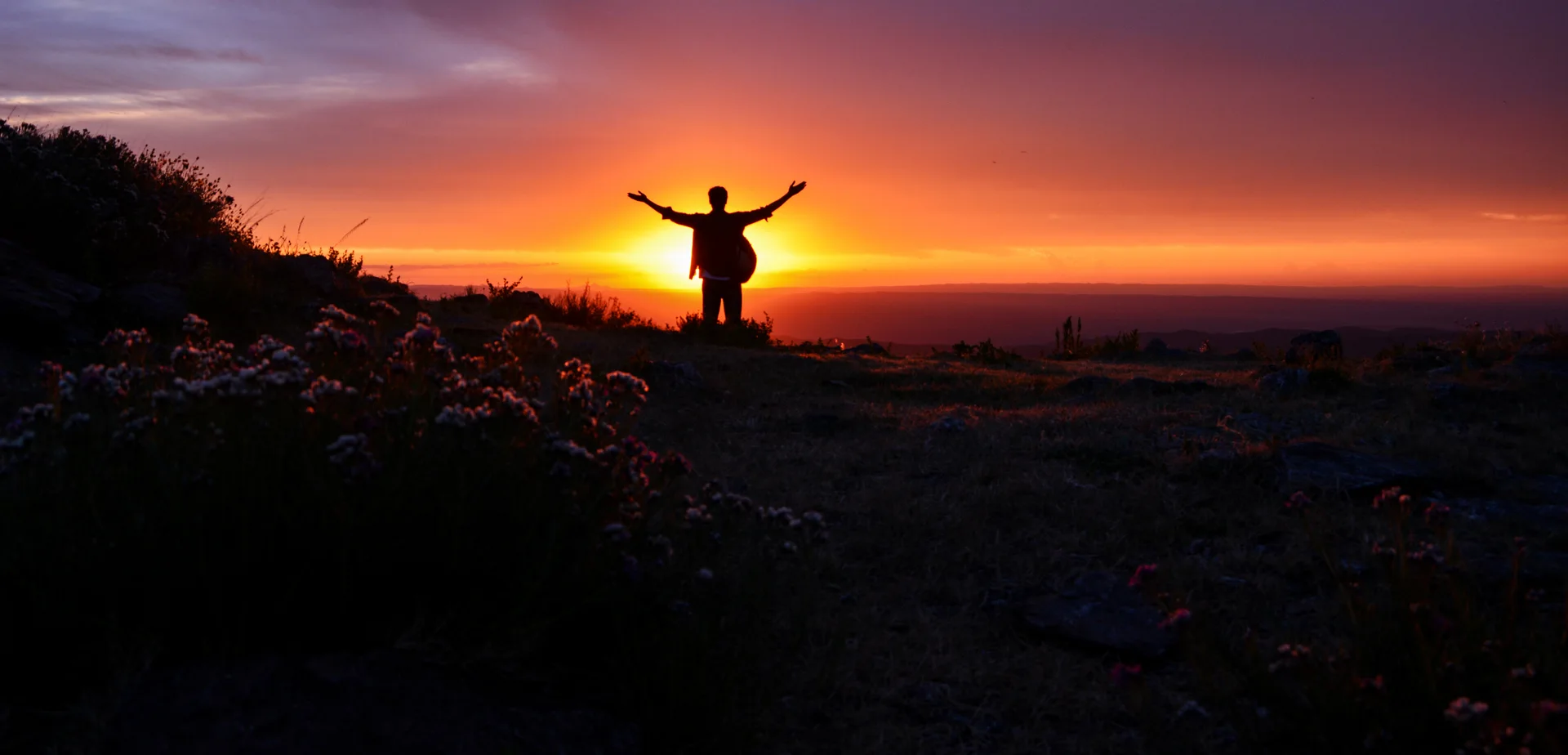Mountain sunset and a distant silhouette in Capilla del Monte
