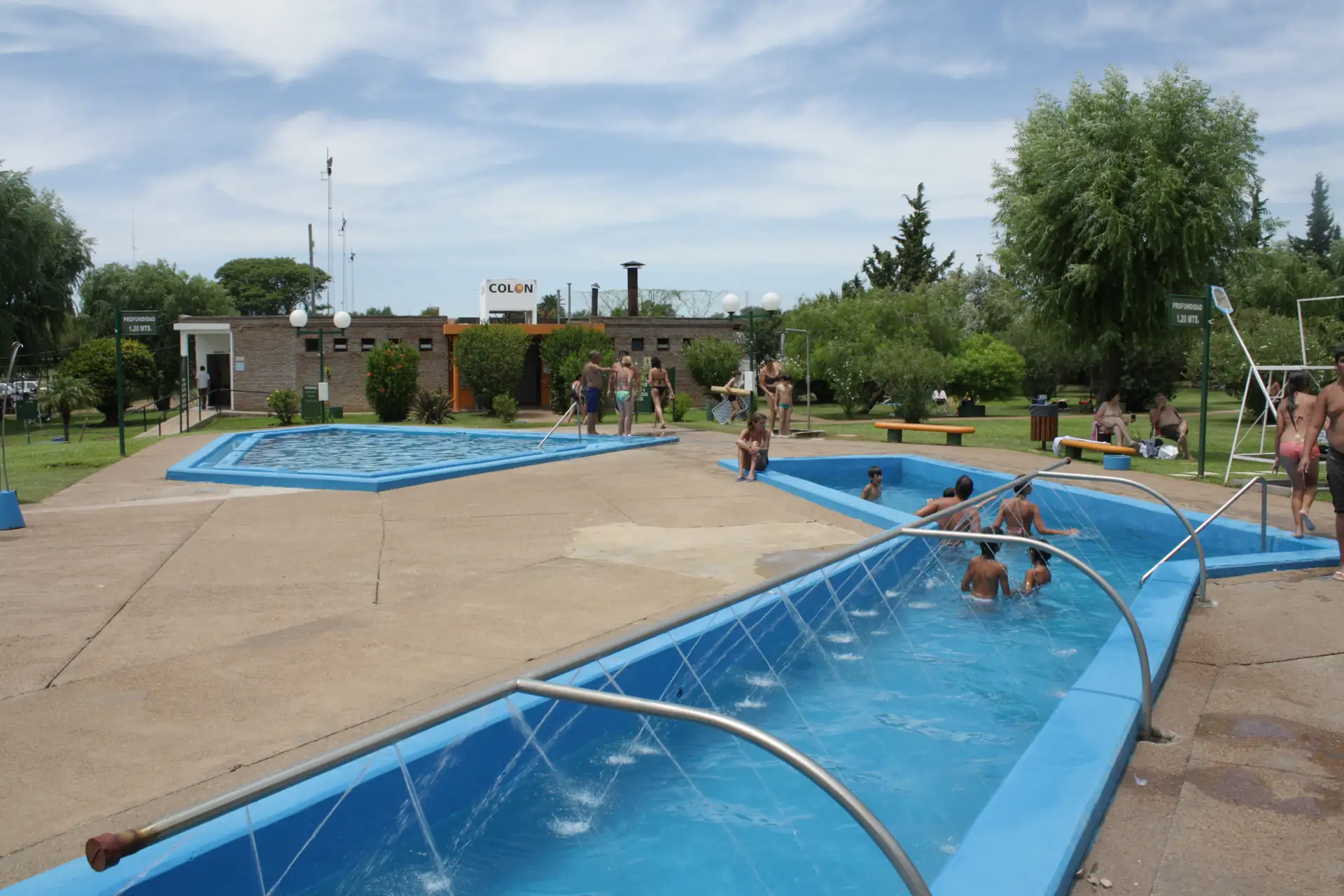 Outdoor pools and surrounding trees at Termas de Colón