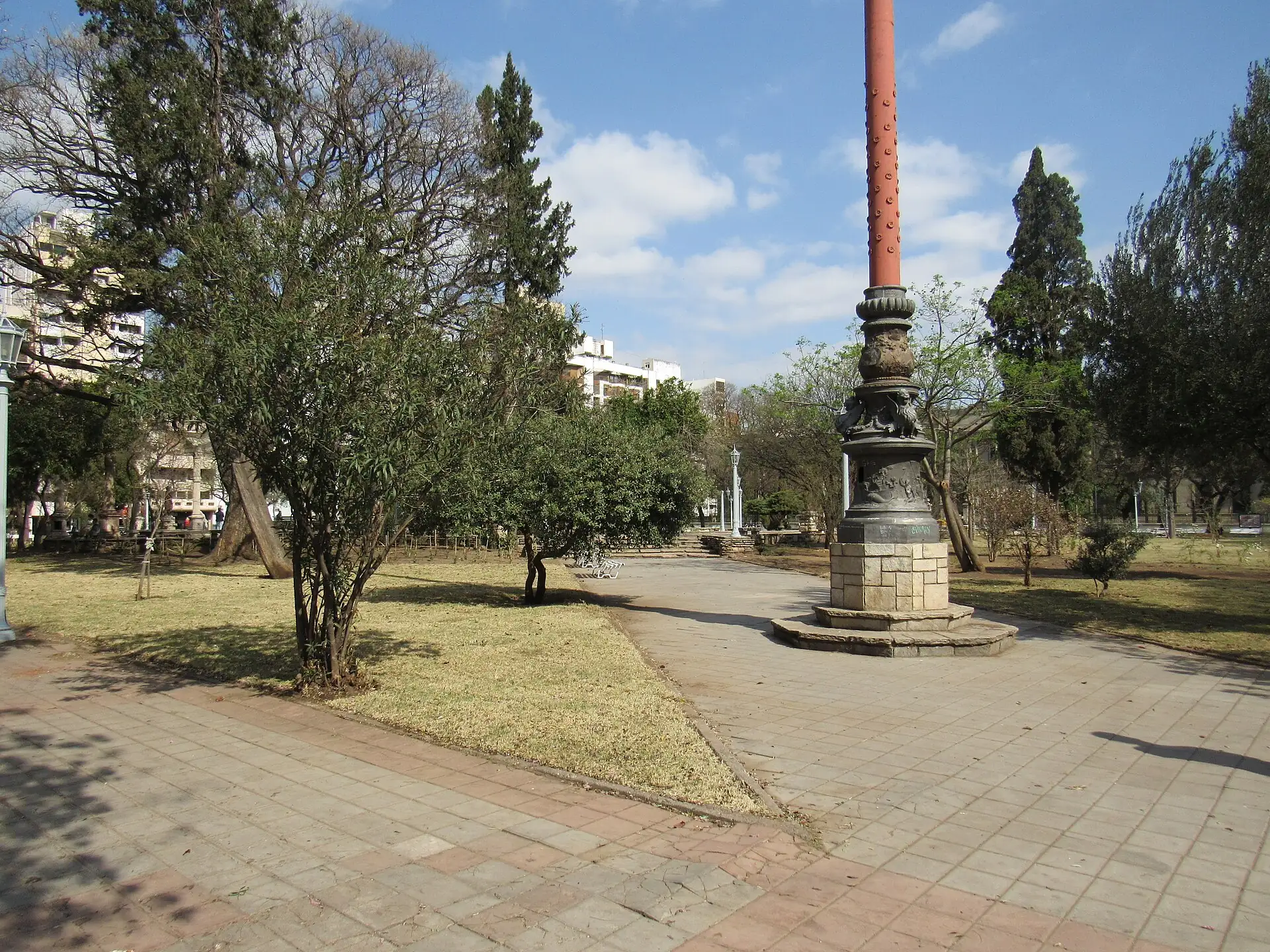 Plaza Colón paths, trees and monument, Córdoba, Argentina