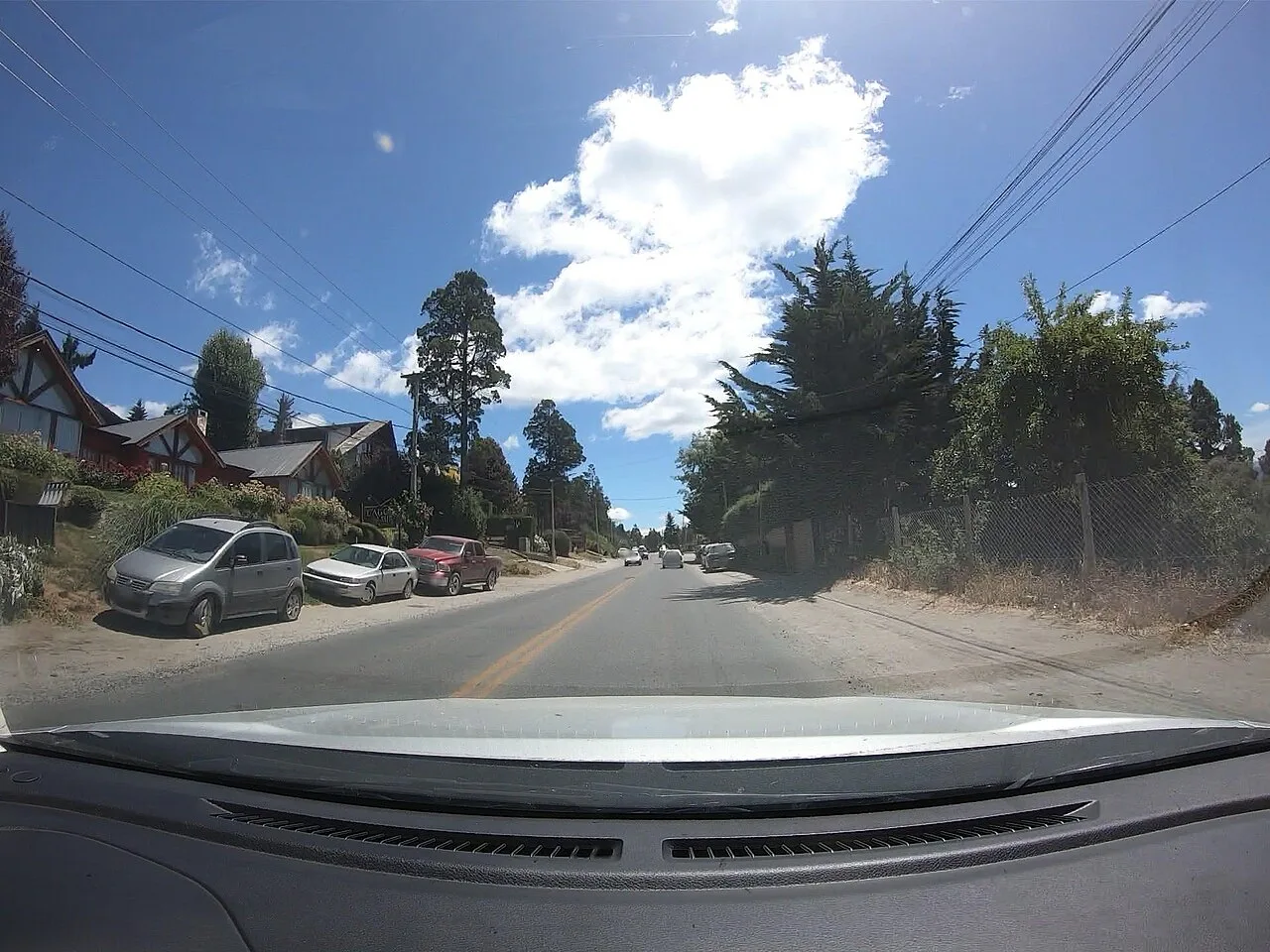 Street, homes and trees photographed inside Melipal in Bariloche