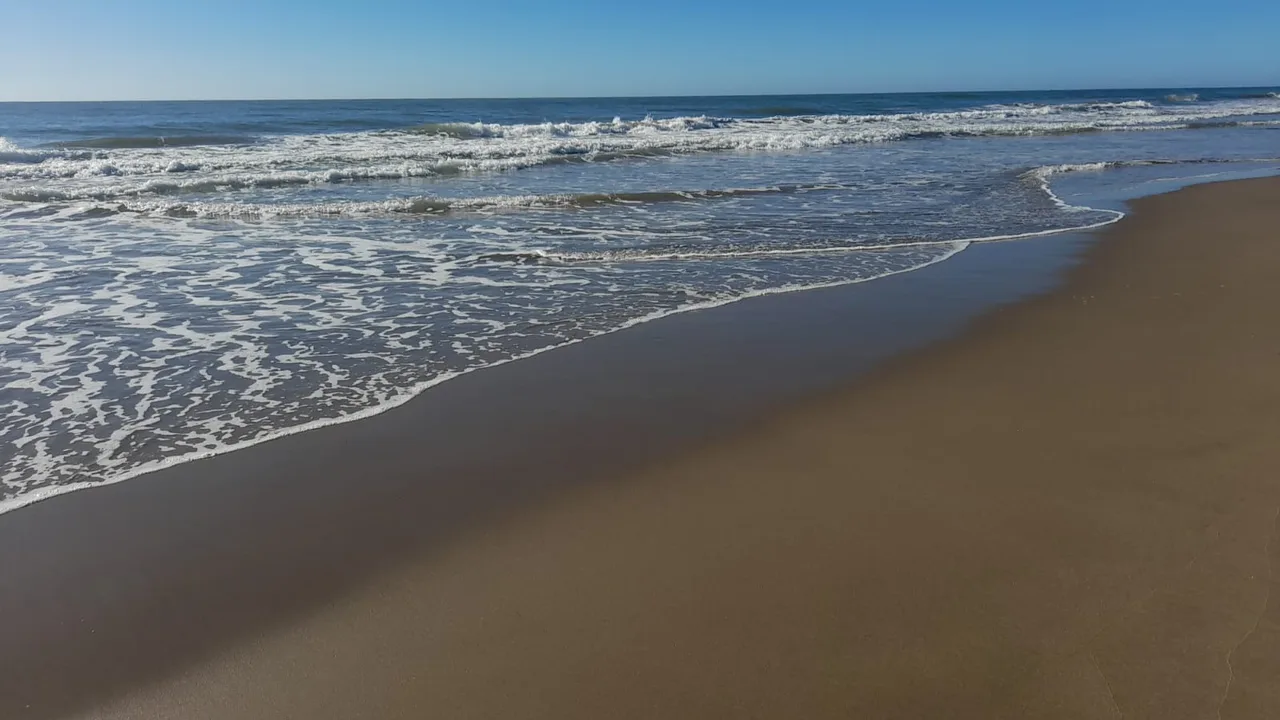 Sea and breaking waves on the Cariló beach