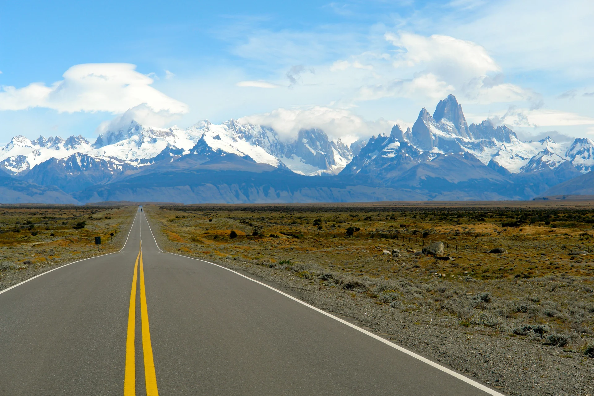 A paved road leading toward the mountains near El Chaltén