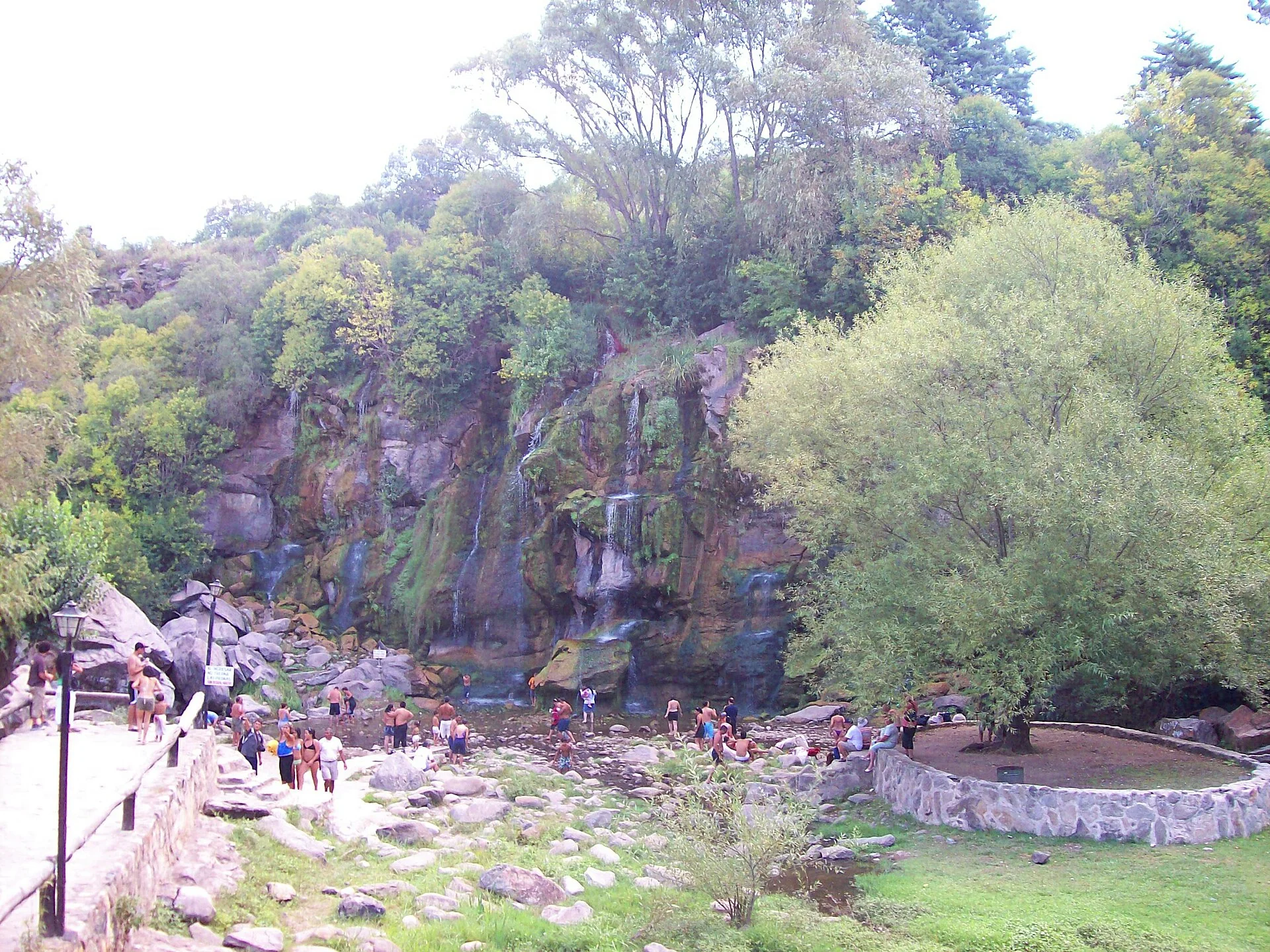 Waterfalls, rocks and visitors at the Seven Cascades recreation area
