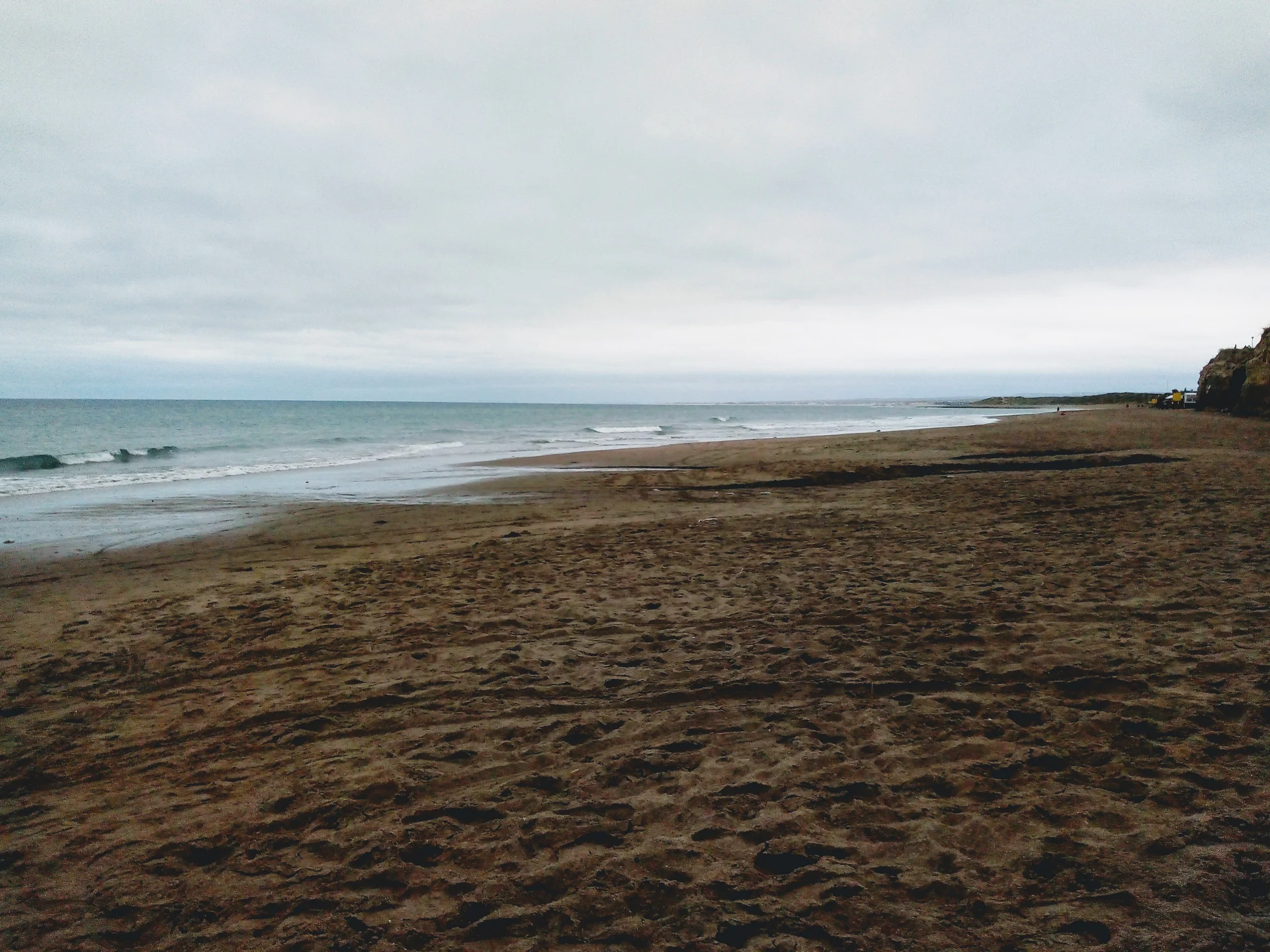 Sand, sea and coastal cliffs at Bajada 1 in Las Grutas