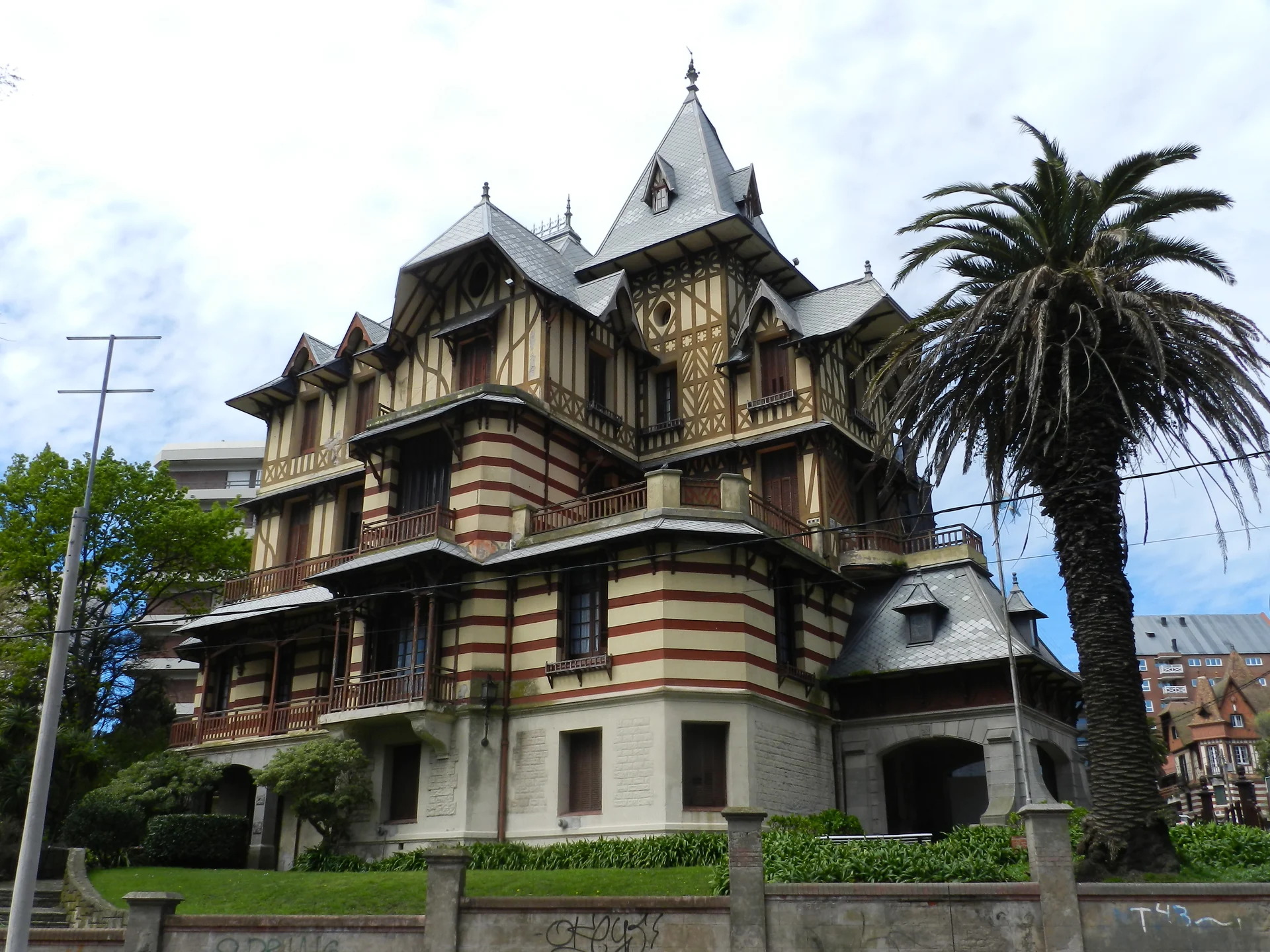 The tall gabled facade and balconies of Villa Ortiz Basualdo, home to the Castagnino museum