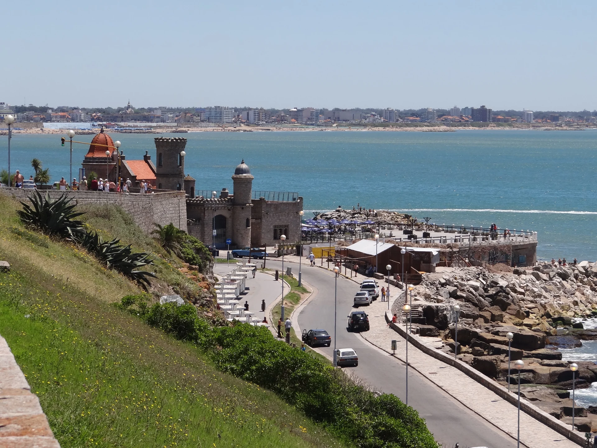 Torreón del Monje beside the sea, with its terrace and coastal road