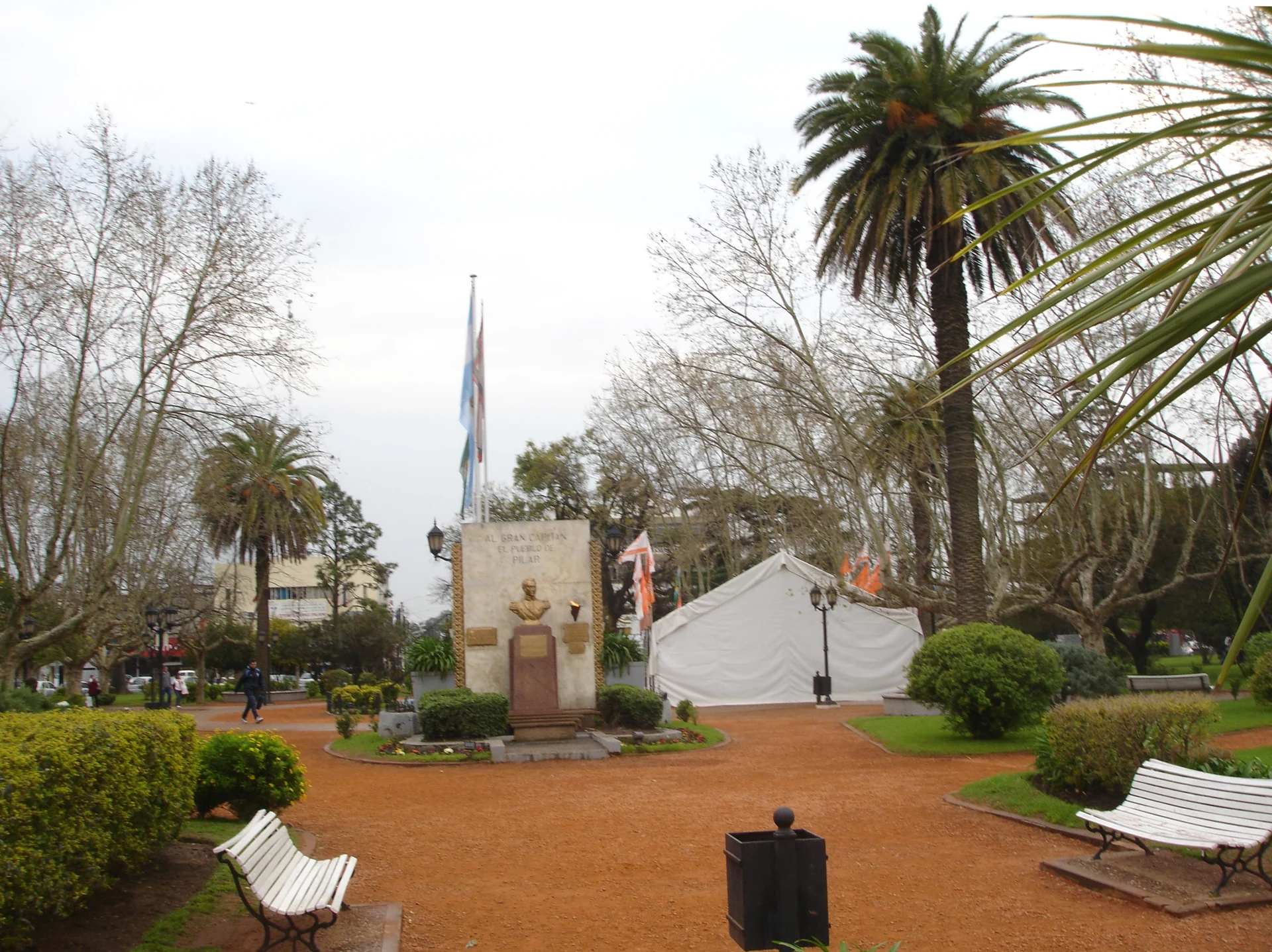 Trees, benches and the San Martín monument in Pilar's central plaza