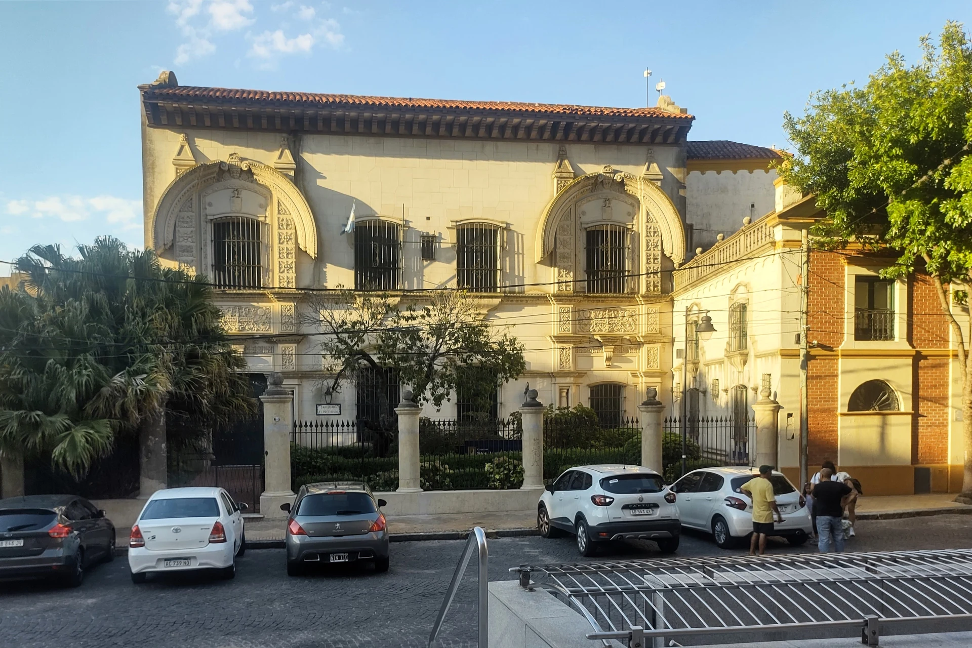 Historic Anchorena house with ornate windows on a San Isidro street