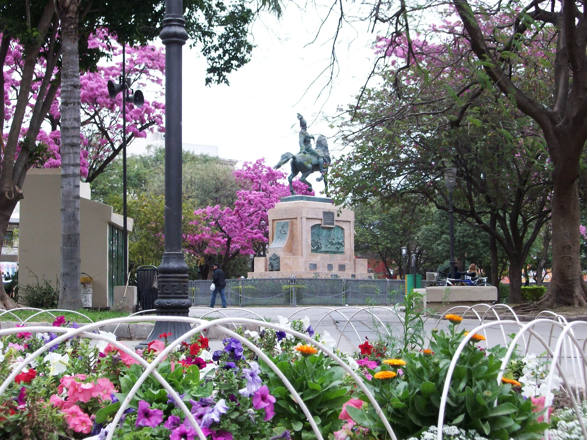 Trees, flower beds and the equestrian monument in Plaza Libertad, Santiago del Estero, photographed January 28, 2014