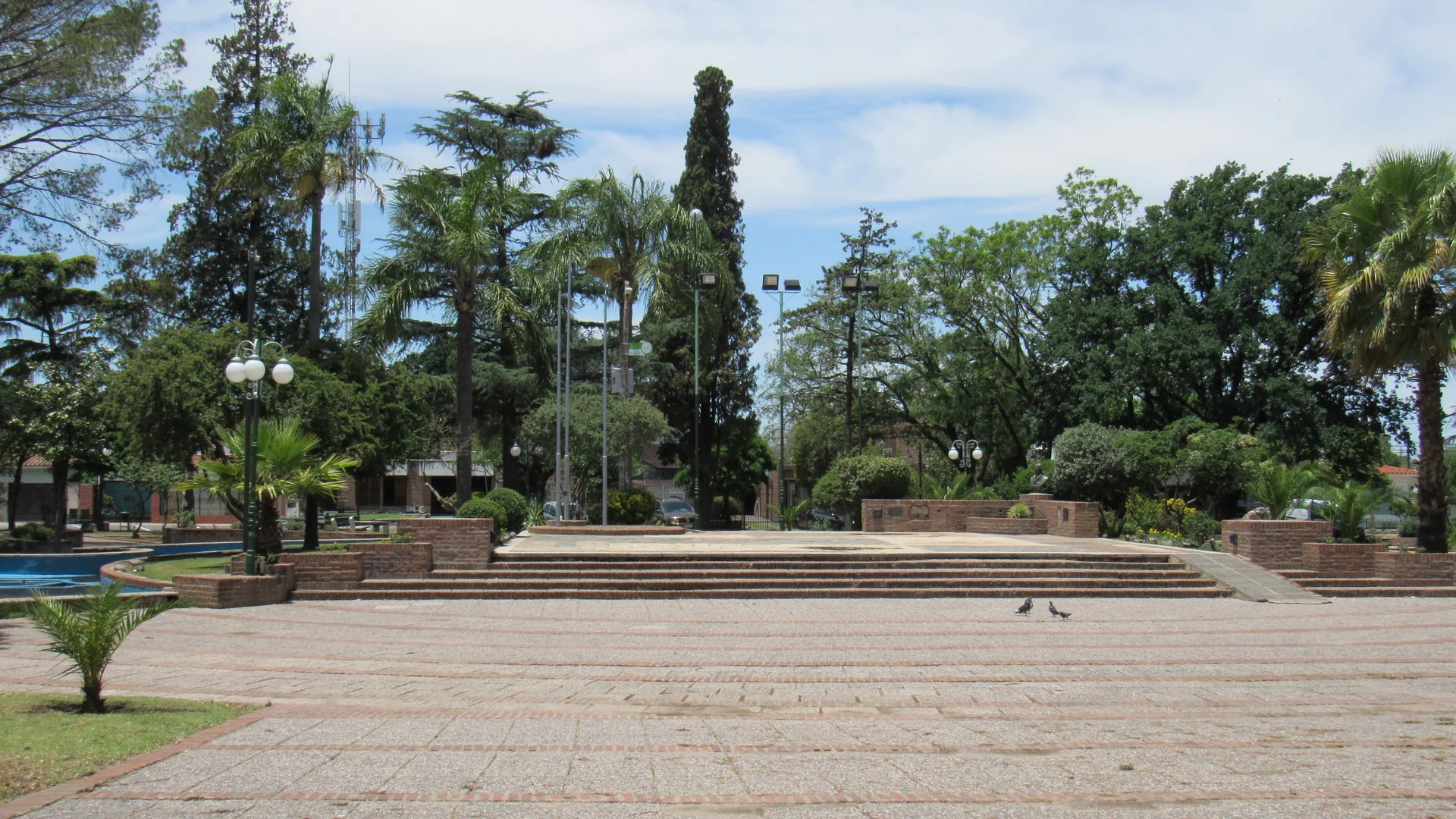 Trees, paths, brick planters and steps in Plaza Manuel Belgrano, Villa Allende