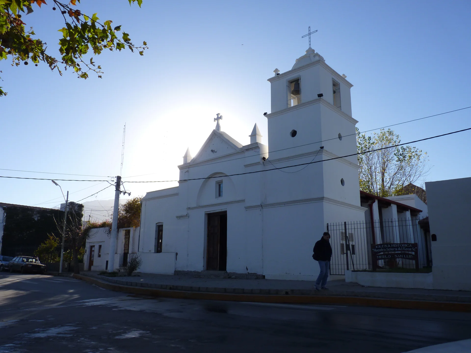 White historic Rosario chapel with a bell tower beside the street in Villa de Merlo, photographed June 25, 2012